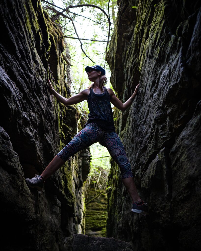 woman doing yoga in the woods