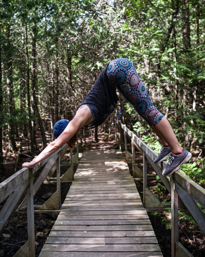 woman doing yoga in the woods