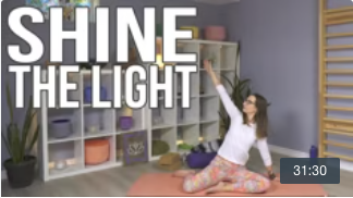 Carole Carter in Living Lotus Online yoga studio demonstrating seated restorative yoga pose