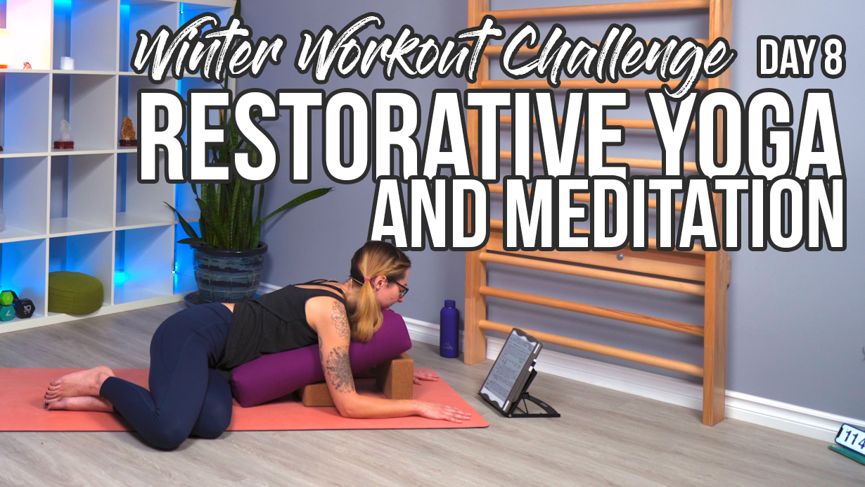 Carole Carter from Living Lotus Online on a yoga mat demonstrating restorative yoga pose with bolster and yoga block props