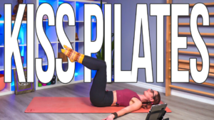 Carole Carter from Living Lotus Online laying on a yoga mat demonstrating pilates movement technique