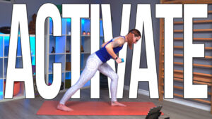 Carole Carter from Living Lotus Online on a yoga mat demonstrating crescent lunge half fold row with weights