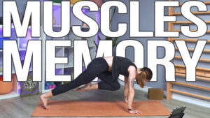 Carole Carter from Living Lotus Online on yoga mat demonstrating plank with knee to chest Phalakasana Kumbhakasana